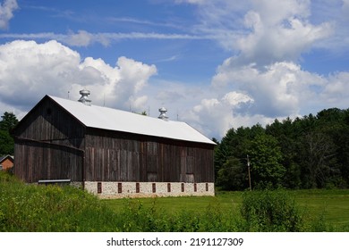 Rustic Farmhouse Sits On Countryside 