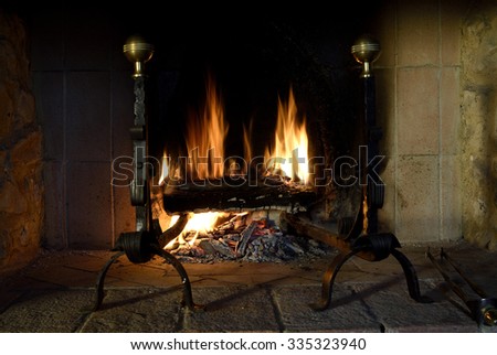 rustic fireplace with fire