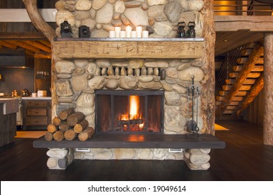 Rustic Fireplace In Log Cabin