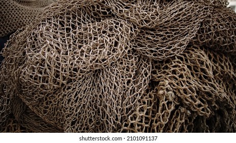 Rustic Fishing Net Stacked As Background