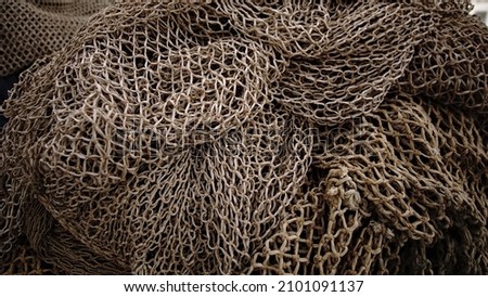 rustic fishing net stacked as background