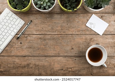 Rustic flat lay desk background with computer keyboard, succulent plants, stationery and tea cup. large copy space - Powered by Shutterstock