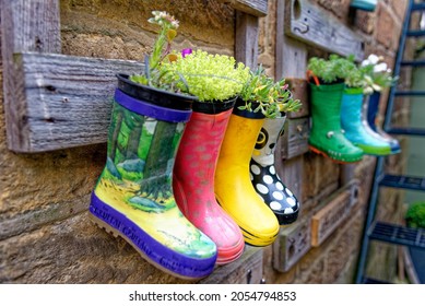 Rustic Garden Boots Pots In Rural Village - Garden Ideas And Small Garden Design - Robin Hood Bay Village Street Scenes - North Yorkshire, England - 14th Of July 2021