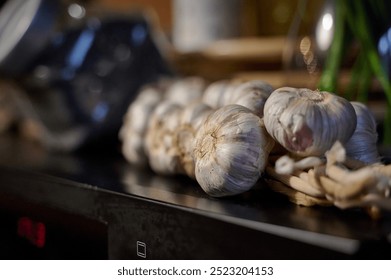 Rustic Garlic Display on Kitchen Counter in Warm, Ambient Light, Ready for Meal Preparation