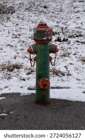 Rustic Green Fire Hydrant Centered Against a Snowy Ground Background