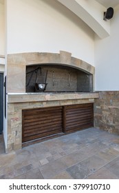 Rustic Grill In Outdoor Kitchen In Luxury Villa Exterior