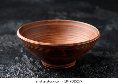 brown clay bowl