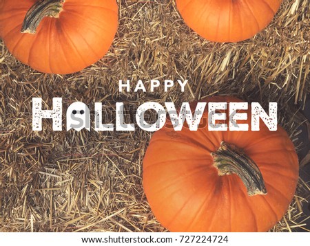 Rustic Happy Halloween Text With Ghost Icon Over Pumpkins and Hay From Directly Above