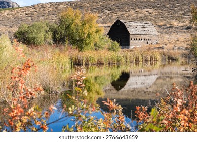 Rustic Haynes Ranch Barn Reflection Osoyoos BC. The Haynes ranch barn in the Okanagan. This historic site was home to one of the early settlers in the area. British Columbia, Canada.
