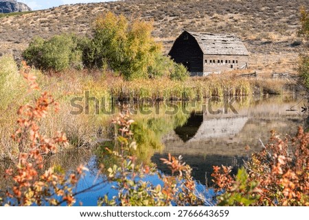 Rustic Haynes Ranch Barn Reflection Osoyoos BC. The Haynes ranch barn in the Okanagan. This historic site was home to one of the early settlers in the area. British Columbia, Canada.
