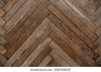 A rustic herringbone pattern made of aged wooden planks evokes a cozy atmosphere.