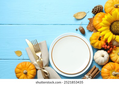 Rustic holiday table setup. Top view with plates, cutlery and autumn decorations. Empty space for your text  - Powered by Shutterstock