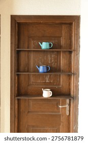 Rustic Interior Design with Decorative Teapots, Creative Home Decor Using Antique Doors, Vintage Wooden Door Repurposed as Shelf