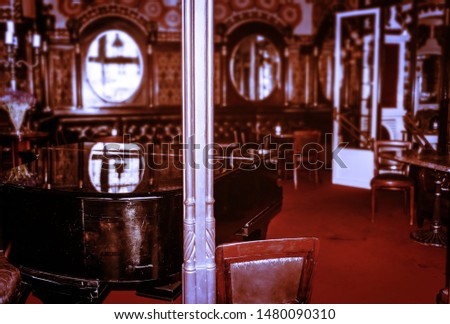 Rustic interior of an empty restaurant in the city center. Sukiennice hall. Cracow, Poland. Downtown earlymorning. Main square in the historic city. Nobody at the tables. Vacation in a royal town.