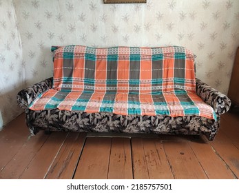 Rustic Interiors. Photo Of A Village House. An Old Sofa Covered With A Blanket. Outback. Floral Wallpaper. Russian Interiors. The Life Of Ordinary People. Village House Interior. Poor House