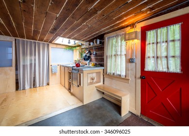 Rustic kitchen in a bright cabin. Interior design. - Powered by Shutterstock