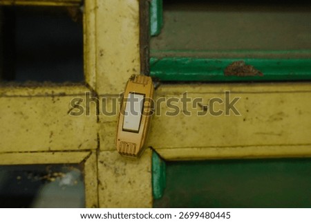 Rustic light switch beckons from aged wall, inviting a touch of vintage charm and characterful detail to your project, with unique retro appeal