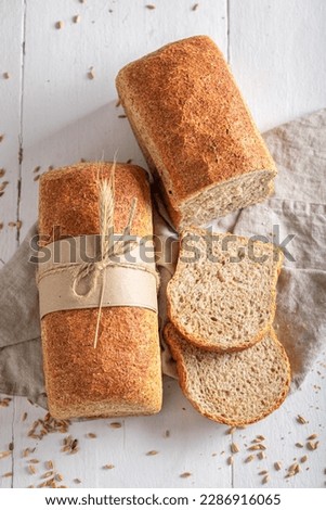 Rustic loaf of breads ready to eat. Bread in countryside.