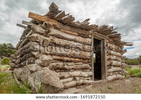 A rustic log cabin made from rough beams that never went through a proper sawmill. Cave Valley, White Pine Couty, Nevada, USA.