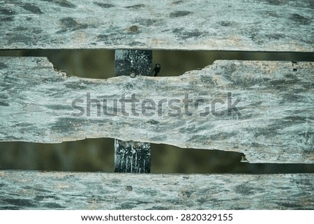 Rustic Marine Pier Construction Featuring Rusted Nail Close Up