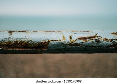 Rustic Metal Bar Texture In Front Of Sea Front Beach