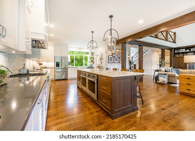 Rustic Modern Farmhouse Kitchen With White Cabinets Wrought Iron And Wood Chairs Eating Counter And Light Fixtures