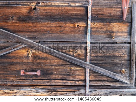Rustic Old Barnwood On Side of a Structure With Handle & Iron fixtures
