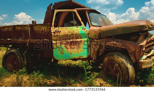 Rustic old chevy farm truck with green door used as\
target practice on an abandon farm near westover maryland somerset\
county 