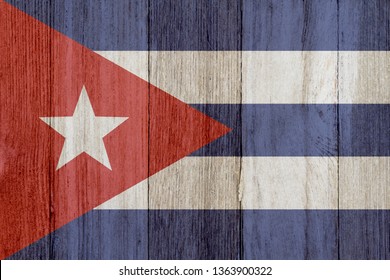 A Rustic Old Cuban Flag On Weathered Wood For A Background