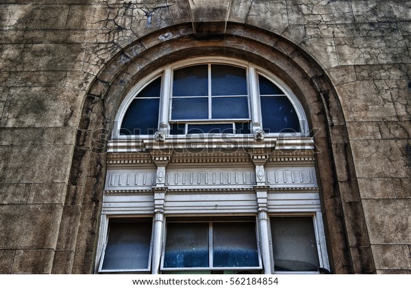Rustic old\
derelict architecture colonial prewar railway railroad train\
station iconic structures wall texture peeling paint shadow South\
East Asia city island state Singapore Malaya\
