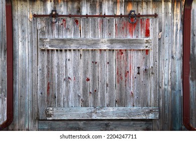 A Rustic Old Farm Barn Sliding Door Entrance Farming Storage Wooden Boards Weathered Vintage Retro Building Exterior Doorway