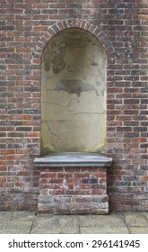 Rustic Old Stone Alcove Set In A Brick Wall
