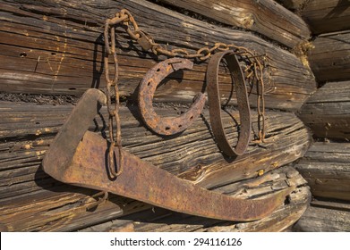 Rustic Old Tools On A Wooden Barn Wall