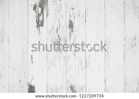 Rustic painted wood wall or floor. Rough wooden planks. Peeling white paint with light neutral flat faded tones.