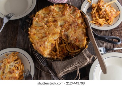 Rustic Pasta Casserole Baked In A Cast Iron Pan And Served On Wooden Table. Overhead View