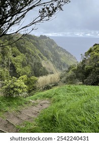 Rustic path down mountain overlooking the ocran