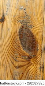 Rustic Pine Wood Grain Texture with Natural Knot Pattern. High-resolution closeup of a natural knotty pine wood texture featuring organic concentric rings, warm amber tones, and rich rustic grain detail. Perfect for background design.