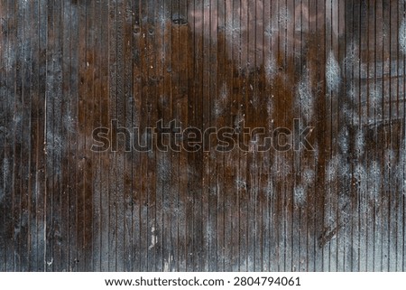 Rustic planks with scorched surface, dry grain, and uneven edges