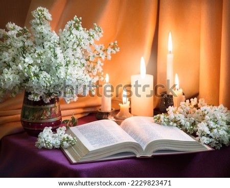 Rustic pray psalm write love table space card. Holy age jew home culture god Jesus Christ literary night even art rose lilac petal bunch still life flame fire glow symbol concept backdrop wed decor 