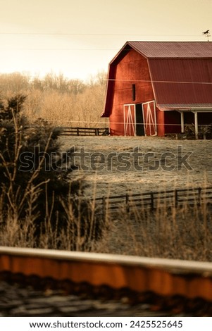 A rustic red barn in the rolling hills of Tennessee 