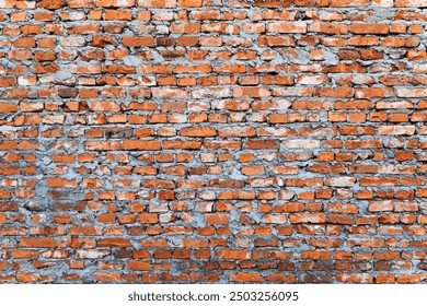 Rustic Red Brick Wall Texture. The wall showcases a rough texture with varying shades of red, orange, and gray. Ideal for backgrounds, architectural designs, or industrial-themed projects.
