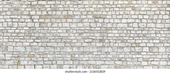 Rustic Rough Garden Wall Made Of Sandstone Blocks.