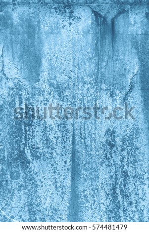 A rustic rough industrial raw concrete textured wall coloured blue.