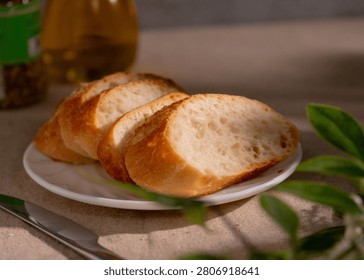 Rustic Sliced Artisan Bread with Olive Oil on White Plate, Cozy Food Photography