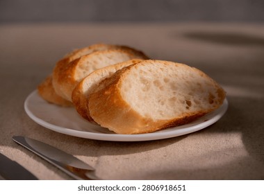 Rustic Sliced Artisan Bread with Olive Oil on White Plate, Cozy Food Photography