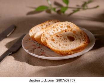 Rustic Sliced Artisan Bread with Olive Oil on White Plate, Cozy Food Photography