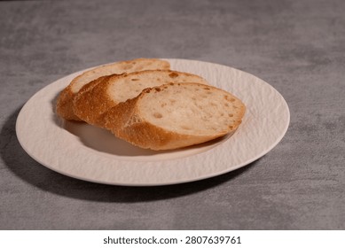 Rustic Sliced Artisan Bread with Olive Oil on White Plate, Cozy Food Photography