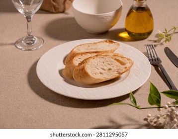 Rustic Sliced Artisan Bread with Olive Oil on White Plate, Cozy Food Photography