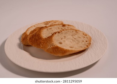 Rustic Sliced Artisan Bread with Olive Oil on White Plate, Cozy Food Photography
