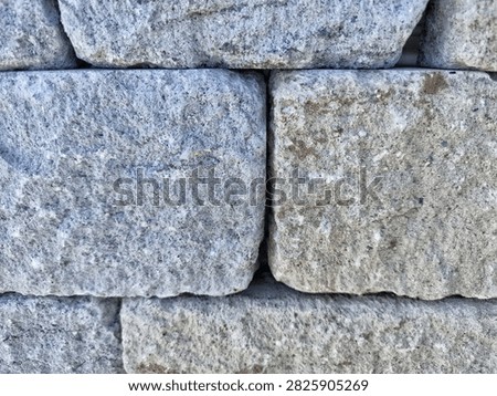 Rustic split face granite wall ashlar blocks with deep shadow gaps for PBR texturing
